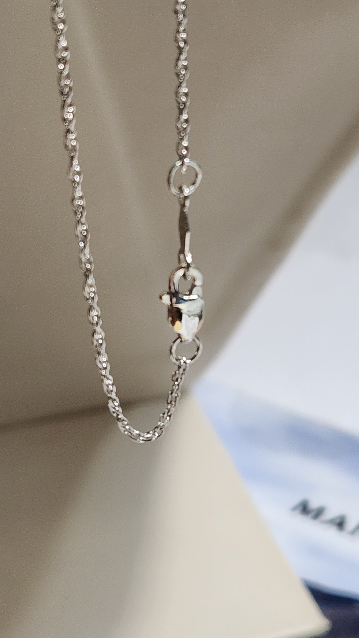 0.90ct clear star brilliant cut Texas topaz is backset in a sterling silver slide pendant and chain.