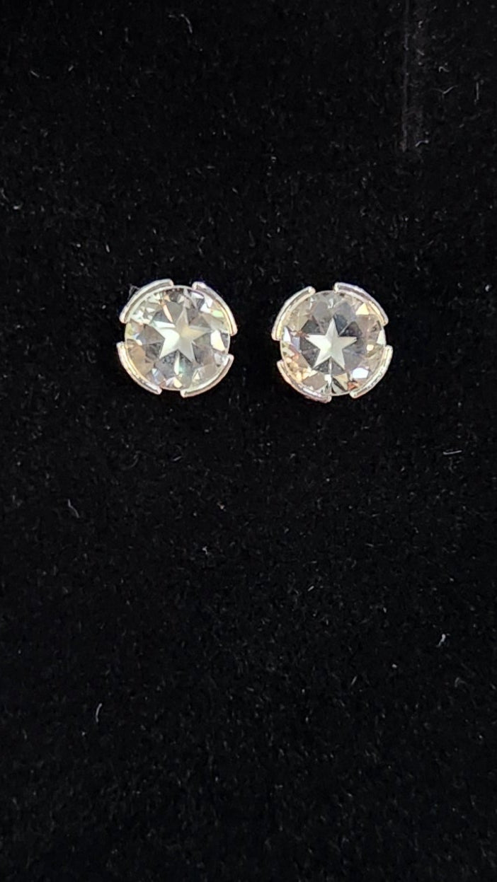 0.90cttw Mason County Clear Topaz Lone Brilliant Star mounted in a Continuum Sterling Silver semi-bezel set stud earrings.