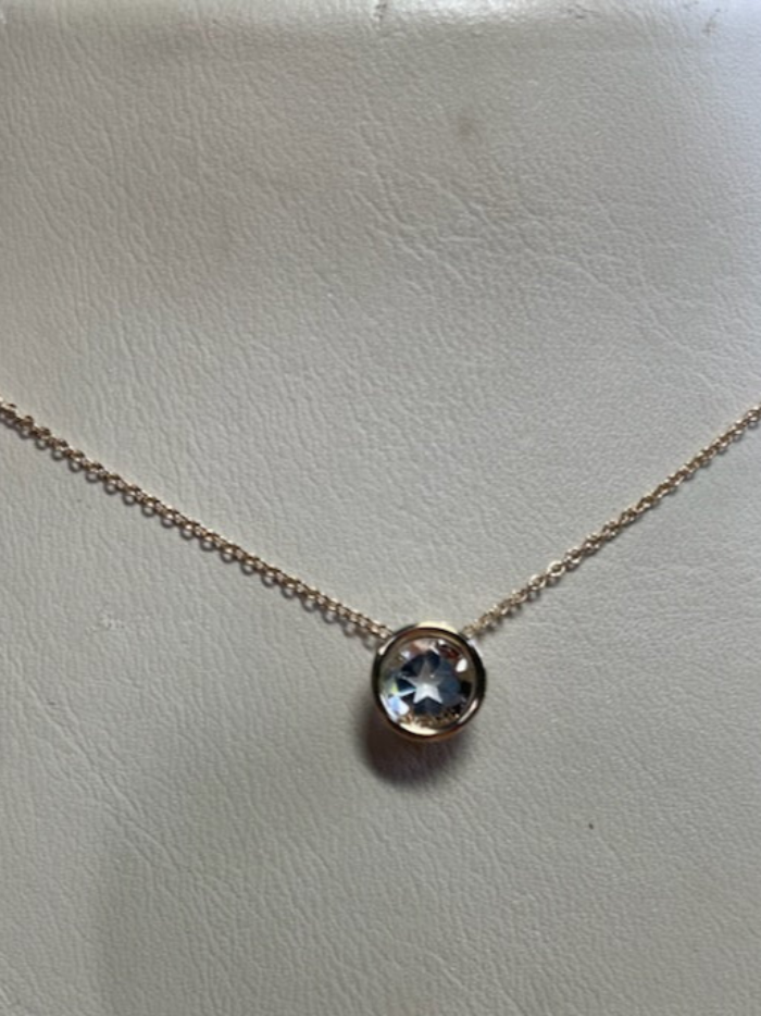 0.95ct Texas topaz is mounted into a 14kt yellow gold slide and chain.