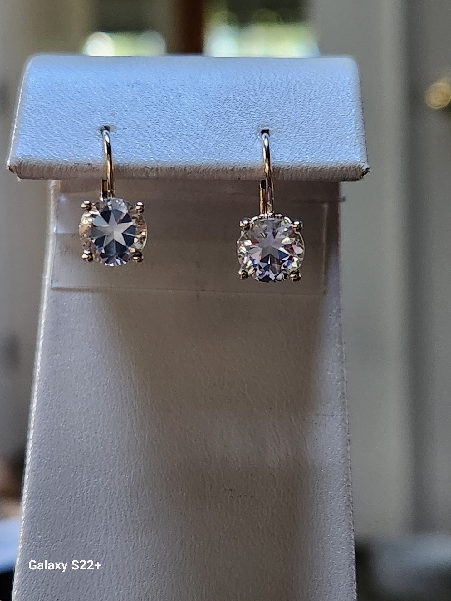 2.90cttw Mason County Clear Topaz Lone Brilliant Star Cut Mounted in a 14kt yellow gold dangle lever back earrings.