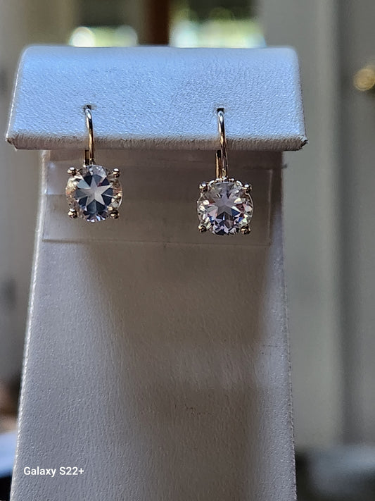 2.90cttw Mason County Clear Topaz Lone Brilliant Star Cut Mounted in a 14kt yellow gold dangle lever back earrings.