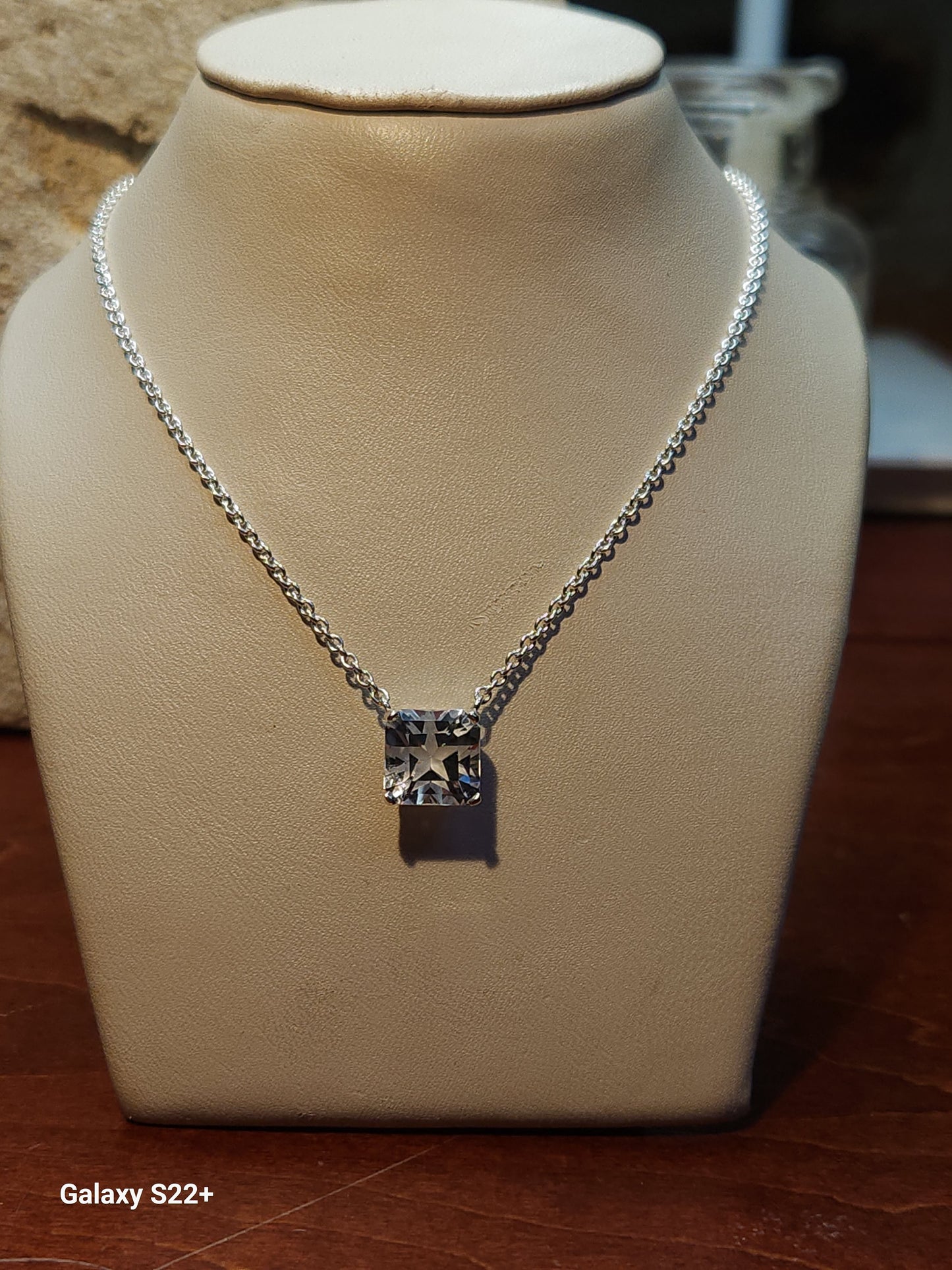 4.73ct colorless Mason Texas topaz square star cut is set in a simple sterling silver pendant and chain.