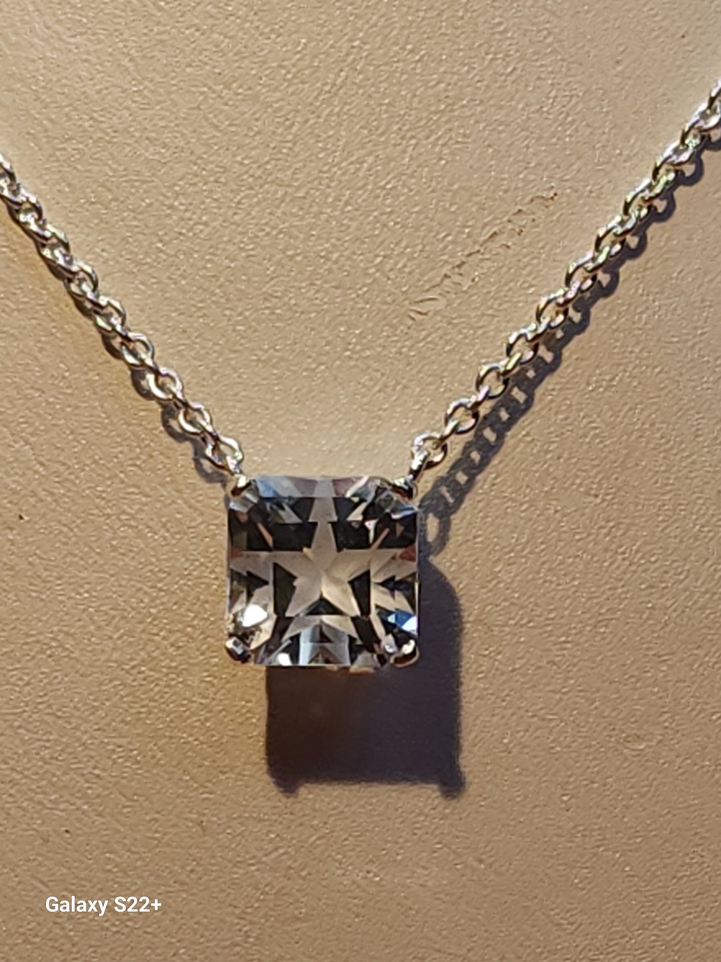 4.73ct colorless Mason Texas topaz square star cut is set in a simple sterling silver pendant and chain.