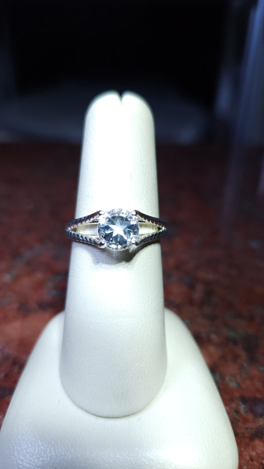 1.45ct Mason County clear star brilliant cut topaz in a split shank style ring in contiuum silver.