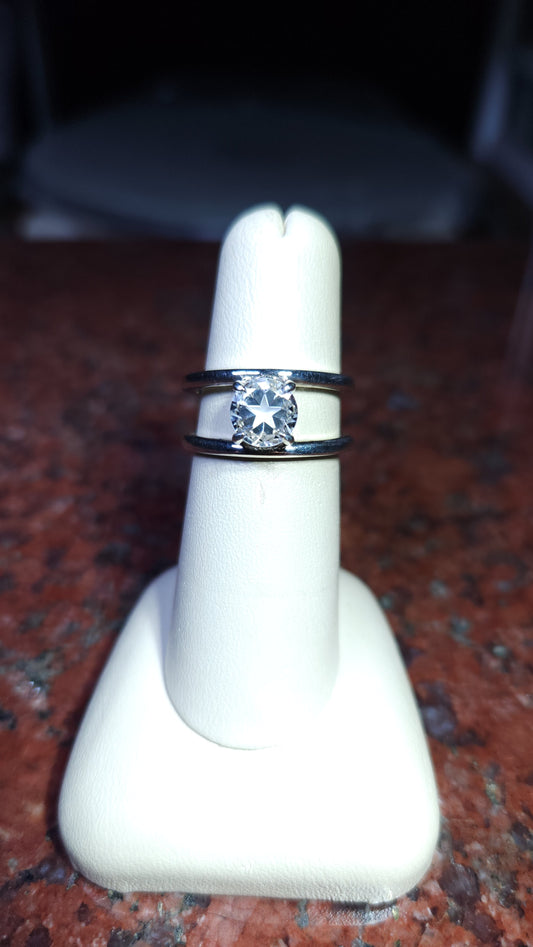 1.45ct Mason County clear star brilliant cut topaz in a double shank style ring in contiuum silver.