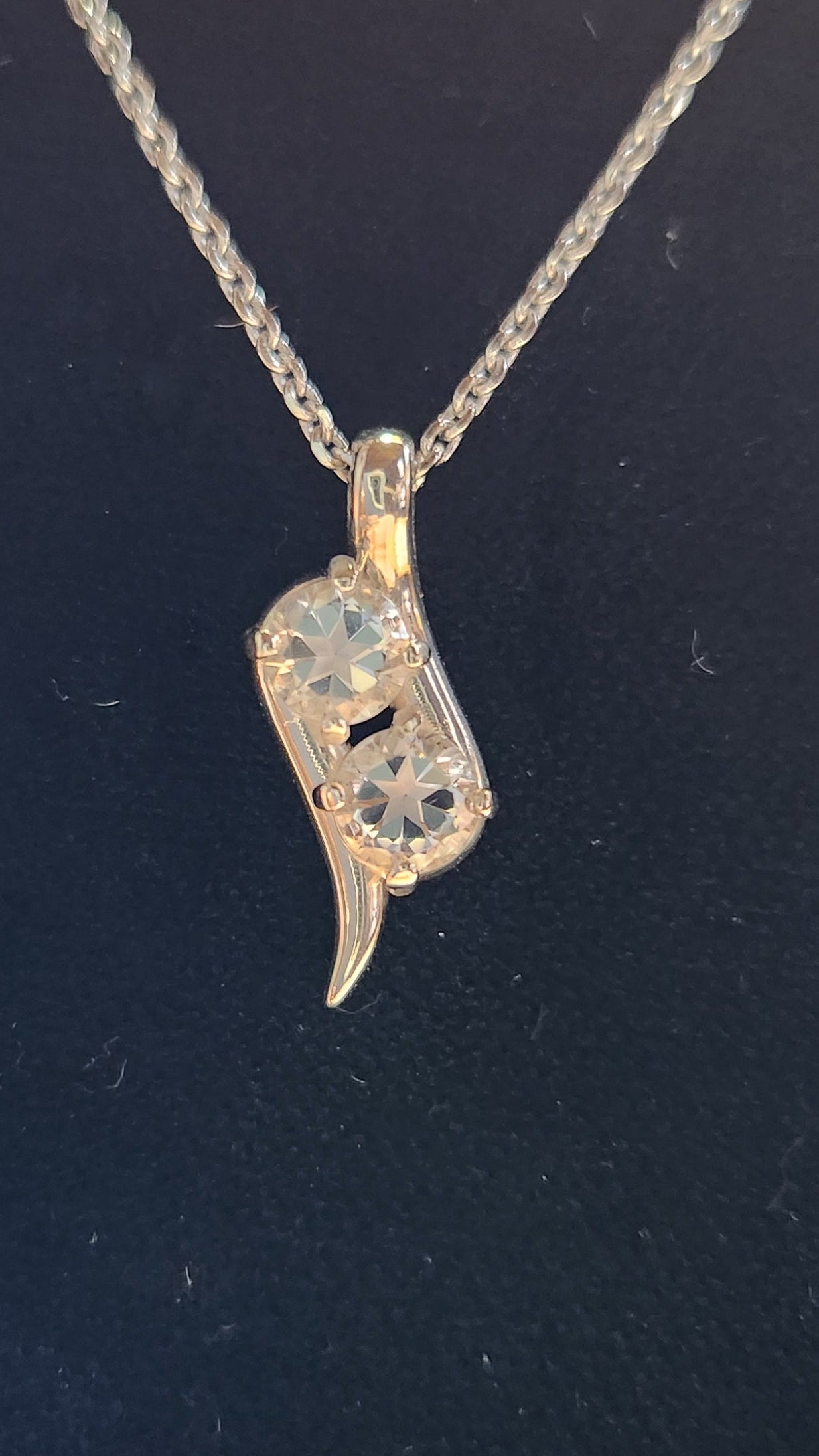 0.90cttw Mason County clear star brilliant cut topaz mounted in a 2 stone Continuum silver pendant.