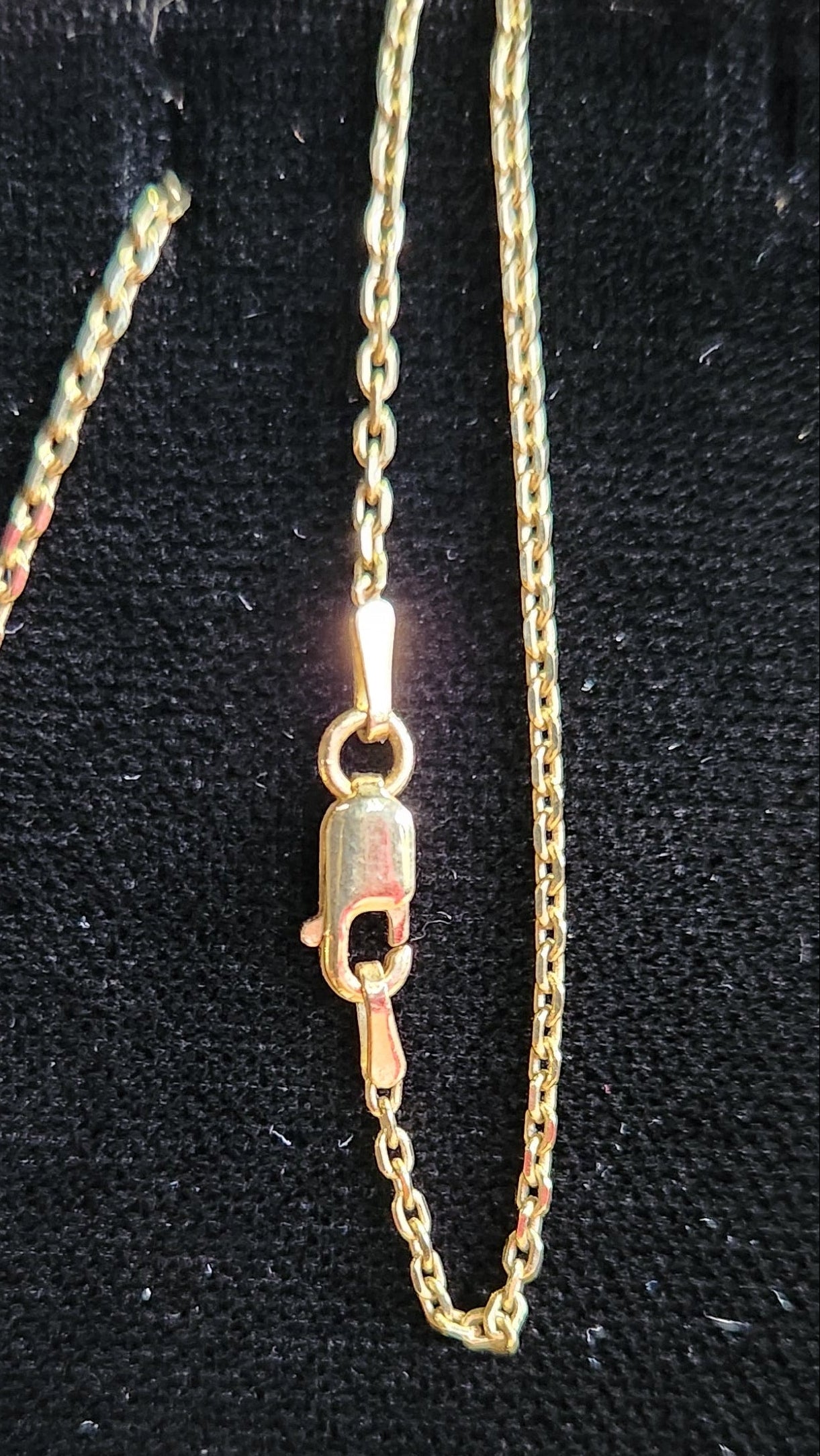 1.45 ct clear star brilliant cut Texas topaz is set in a 14kt gold bezel slide pendent on a gold chain.