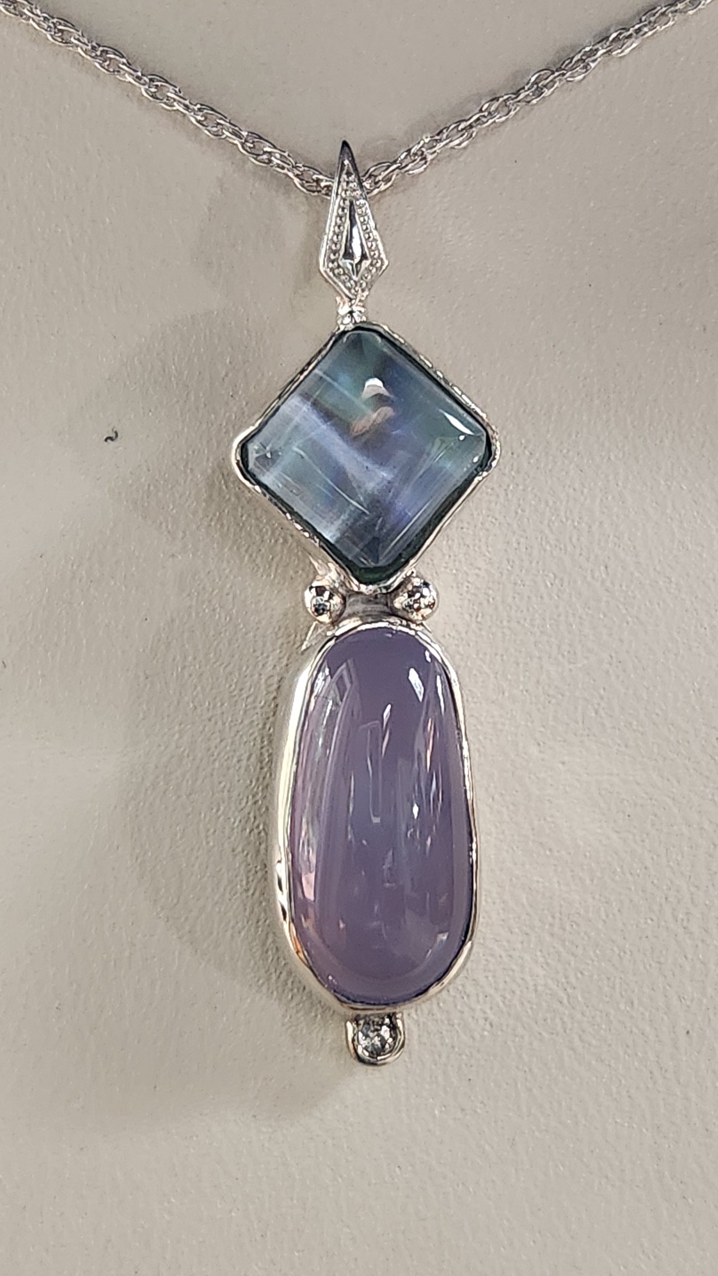 5.92ct Fancy cabochon Holley blue agate with a bezel set Texas topaz over California abalone. 1.02ct Oregon sunstone necklace. (Copy)