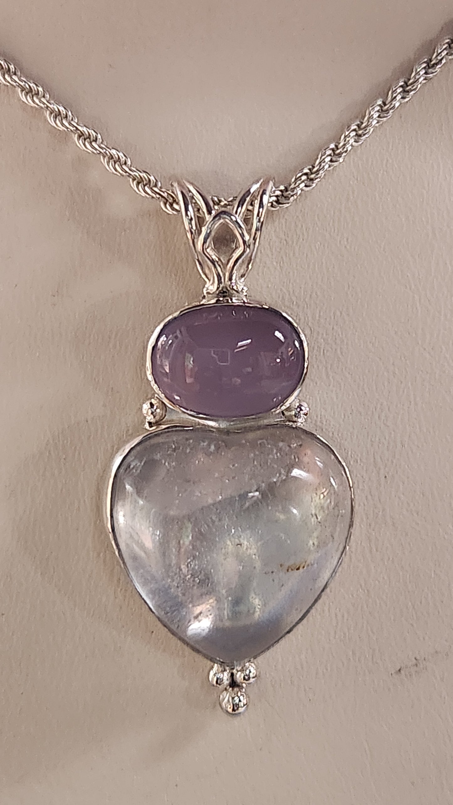 39.46ct Heart shaped Topaz and with a purple Holley blue agate cab pendant.