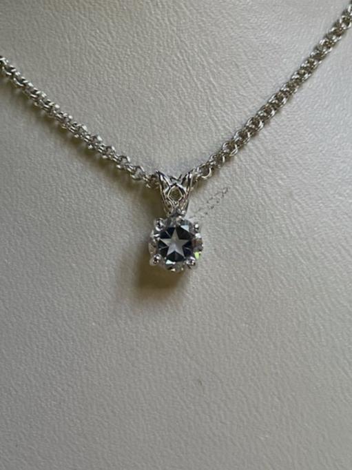 0.95ct clear star brilliant cut Texas topaz is set in a small sterling silver pendant and chain