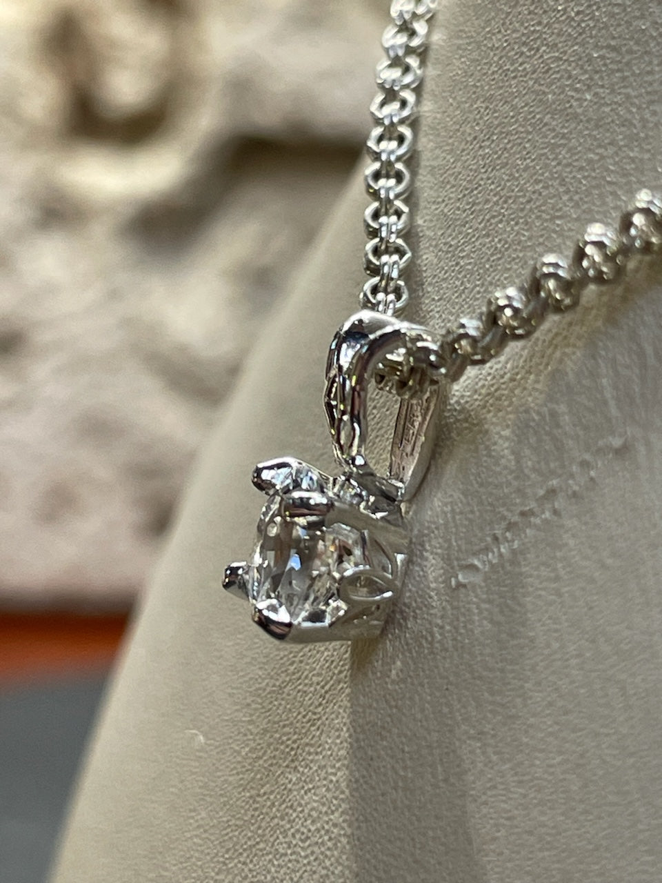 0.95ct clear star brilliant cut Texas topaz is set in a small sterling silver pendant and chain