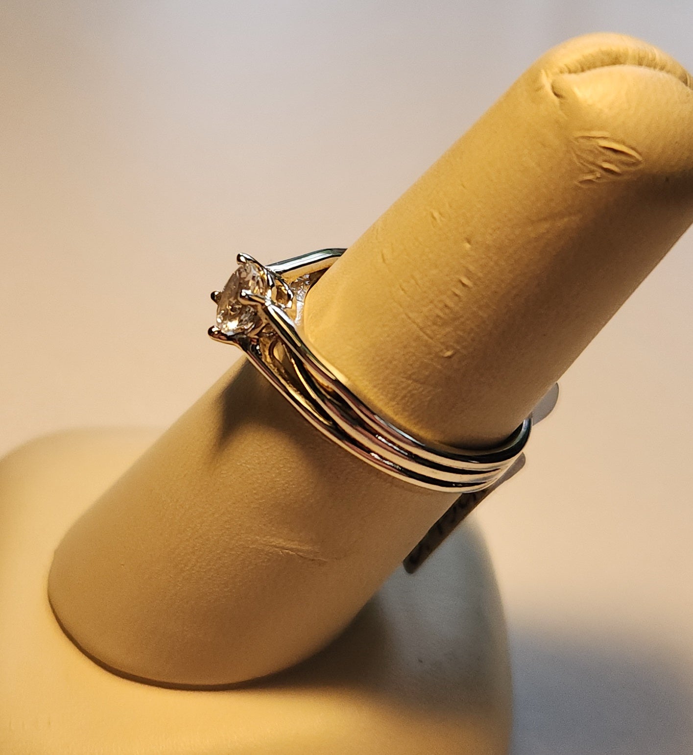 0.45ct Mason County clear star brilliant cut topaz mounted in a sterling silver ring with a 14kt white gold head.